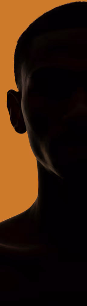 A silhouette of a person with a cell phone.