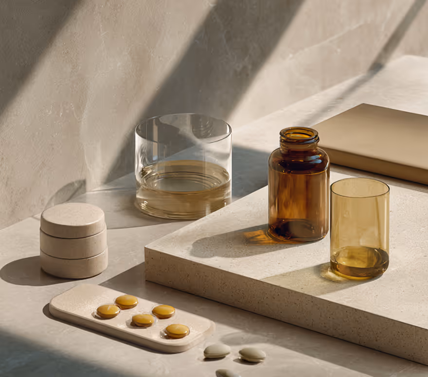 Tabletop with bottles, tablets, and drinking glasses