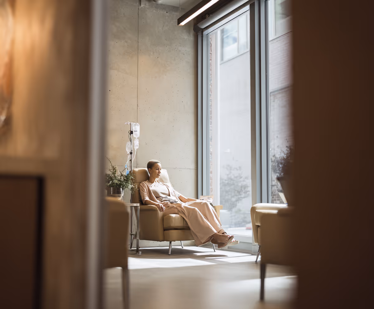 Patient receiving an IV beside a window